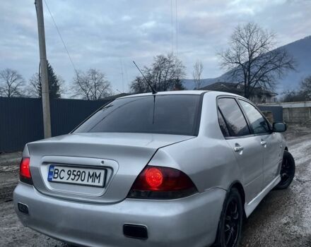 Серый Мицубиси Лансер, объемом двигателя 1.6 л и пробегом 315 тыс. км за 2950 $, фото 2 на Automoto.ua