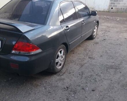 Сірий Міцубісі Lancer, об'ємом двигуна 1.58 л та пробігом 531 тис. км за 2828 $, фото 7 на Automoto.ua