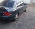 Сірий Міцубісі Lancer, об'ємом двигуна 1.58 л та пробігом 531 тис. км за 2828 $, фото 7 на Automoto.ua