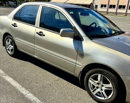 Серый Мицубиси Лансер, объемом двигателя 1.3 л и пробегом 245 тыс. км за 3000 $, фото 5 на Automoto.ua