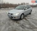 Серый Мицубиси Лансер, объемом двигателя 1.58 л и пробегом 280 тыс. км за 3800 $, фото 1 на Automoto.ua