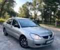 Сірий Міцубісі Lancer, об'ємом двигуна 1.3 л та пробігом 3 тис. км за 2476 $, фото 1 на Automoto.ua