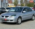 Серый Мицубиси Лансер, объемом двигателя 1.6 л и пробегом 300 тыс. км за 3990 $, фото 1 на Automoto.ua
