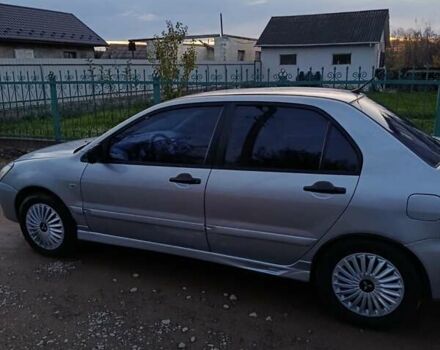 Мицубиси Лансер 2004 в Черновцах на Automoto.ua Серый Мицубиси Лансер, объемом двигателя 1.58 л и пробегом 439 тыс. км за 2750 $, фото 21 на Automoto.ua