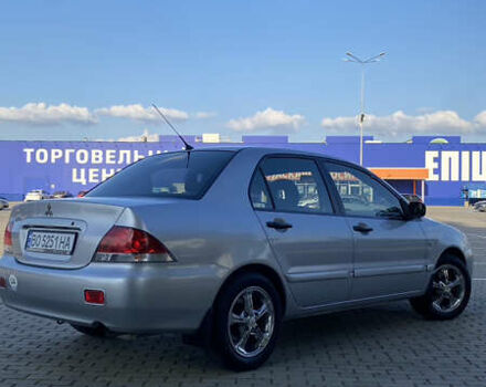 Сірий Міцубісі Lancer, об'ємом двигуна 1.58 л та пробігом 270 тис. км за 1999 $, фото 6 на Automoto.ua