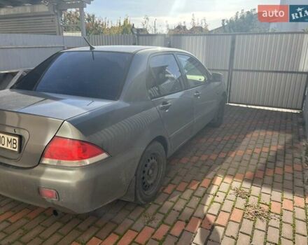 Сірий Міцубісі Lancer, об'ємом двигуна 1.58 л та пробігом 262 тис. км за 3900 $, фото 2 на Automoto.ua