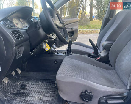 Сірий Міцубісі Lancer, об'ємом двигуна 1.58 л та пробігом 271 тис. км за 3000 $, фото 20 на Automoto.ua