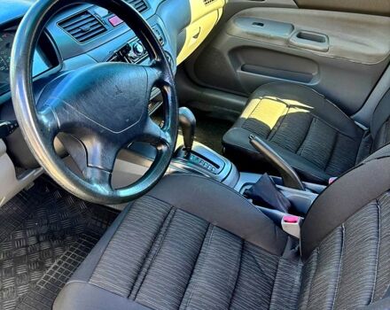 Серый Мицубиси Лансер, объемом двигателя 1.3 л и пробегом 245 тыс. км за 3000 $, фото 4 на Automoto.ua