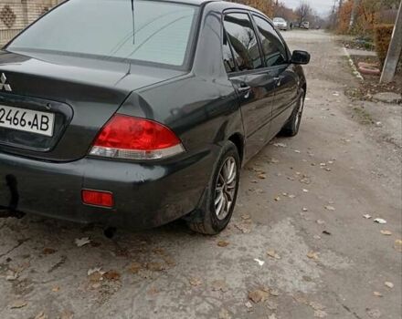 Серый Мицубиси Лансер, объемом двигателя 1.6 л и пробегом 372 тыс. км за 3500 $, фото 3 на Automoto.ua