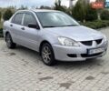 Серый Мицубиси Лансер, объемом двигателя 1.3 л и пробегом 299 тыс. км за 3800 $, фото 1 на Automoto.ua