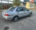Сірий Міцубісі Lancer, об'ємом двигуна 1.58 л та пробігом 271 тис. км за 3000 $, фото 3 на Automoto.ua
