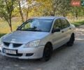 Серый Мицубиси Лансер, объемом двигателя 1.58 л и пробегом 250 тыс. км за 2950 $, фото 1 на Automoto.ua