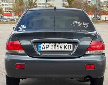 Серый Мицубиси Лансер, объемом двигателя 1.6 л и пробегом 490 тыс. км за 1799 $, фото 3 на Automoto.ua