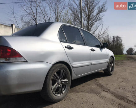 Мицубиси Лансер 2004 в Днепре (Днепропетровске) на Automoto.ua Серый Мицубиси Лансер, объемом двигателя 1.59 л и пробегом 294 тыс. км за 4699 $, фото 4 на Automoto.ua