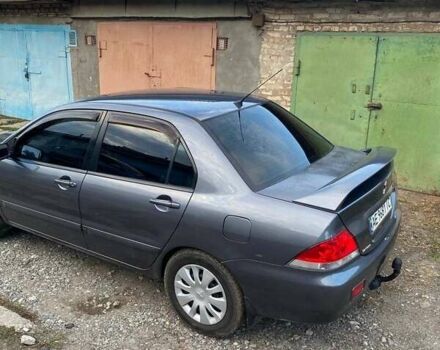 Сірий Міцубісі Lancer, об'ємом двигуна 1.58 л та пробігом 307 тис. км за 3800 $, фото 3 на Automoto.ua