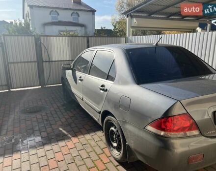 Сірий Міцубісі Lancer, об'ємом двигуна 1.58 л та пробігом 262 тис. км за 3900 $, фото 3 на Automoto.ua