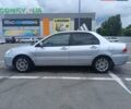 Сірий Міцубісі Lancer, об'ємом двигуна 1.6 л та пробігом 242 тис. км за 4300 $, фото 1 на Automoto.ua