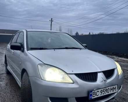 Серый Мицубиси Лансер, объемом двигателя 1.6 л и пробегом 315 тыс. км за 2950 $, фото 1 на Automoto.ua