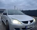 Серый Мицубиси Лансер, объемом двигателя 1.6 л и пробегом 315 тыс. км за 2950 $, фото 1 на Automoto.ua