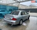 Серый Мицубиси Лансер, объемом двигателя 1.58 л и пробегом 300 тыс. км за 3800 $, фото 1 на Automoto.ua