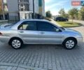Сірий Міцубісі Lancer, об'ємом двигуна 1.59 л та пробігом 200 тис. км за 1899 $, фото 10 на Automoto.ua