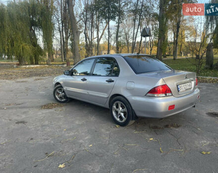 Сірий Міцубісі Lancer, об'ємом двигуна 1.58 л та пробігом 271 тис. км за 3000 $, фото 7 на Automoto.ua