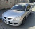 Сірий Міцубісі Lancer, об'ємом двигуна 1.58 л та пробігом 320 тис. км за 3700 $, фото 4 на Automoto.ua
