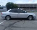 Сірий Міцубісі Lancer, об'ємом двигуна 1.6 л та пробігом 242 тис. км за 4300 $, фото 2 на Automoto.ua