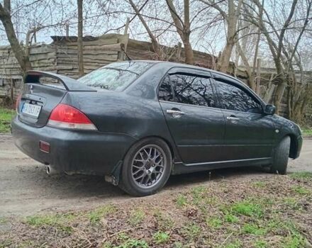 Сірий Міцубісі Lancer, об'ємом двигуна 1.58 л та пробігом 360 тис. км за 4000 $, фото 6 на Automoto.ua