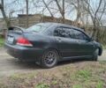 Сірий Міцубісі Lancer, об'ємом двигуна 1.58 л та пробігом 360 тис. км за 4000 $, фото 6 на Automoto.ua
