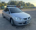 Сірий Міцубісі Lancer, об'ємом двигуна 1.58 л та пробігом 220 тис. км за 4400 $, фото 3 на Automoto.ua