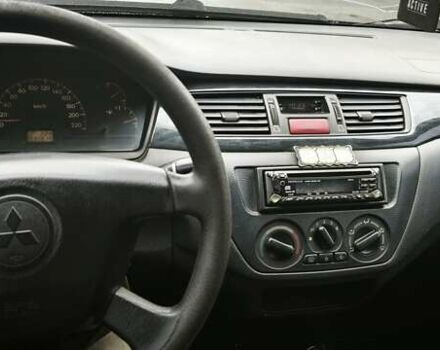 Сірий Міцубісі Lancer, об'ємом двигуна 1.58 л та пробігом 110 тис. км за 2999 $, фото 16 на Automoto.ua