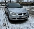 Серый Мицубиси Лансер, объемом двигателя 1.6 л и пробегом 340 тыс. км за 3100 $, фото 1 на Automoto.ua