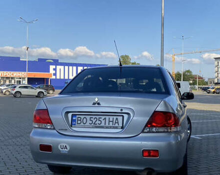 Сірий Міцубісі Lancer, об'ємом двигуна 1.58 л та пробігом 270 тис. км за 1999 $, фото 5 на Automoto.ua