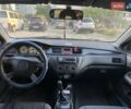 Серый Мицубиси Лансер, объемом двигателя 1.58 л и пробегом 176 тыс. км за 3200 $, фото 1 на Automoto.ua