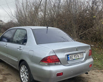 Серый Мицубиси Лансер, объемом двигателя 1.58 л и пробегом 210 тыс. км за 3900 $, фото 3 на Automoto.ua