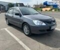 Сірий Міцубісі Lancer, об'ємом двигуна 1.58 л та пробігом 200 тис. км за 4999 $, фото 7 на Automoto.ua