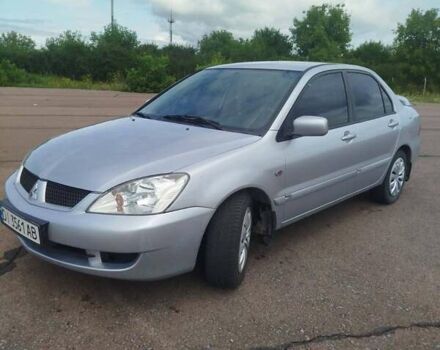Сірий Міцубісі Lancer, об'ємом двигуна 1.6 л та пробігом 250 тис. км за 4000 $, фото 6 на Automoto.ua