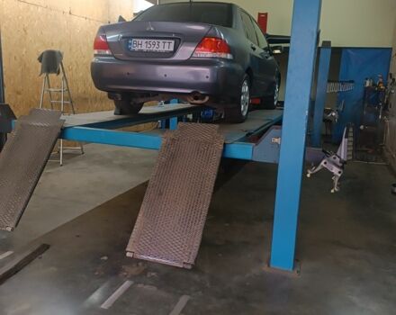 Серый Мицубиси Лансер, объемом двигателя 1.6 л и пробегом 242 тыс. км за 4600 $, фото 4 на Automoto.ua