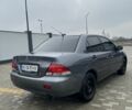 Сірий Міцубісі Lancer, об'ємом двигуна 1.6 л та пробігом 231 тис. км за 3500 $, фото 3 на Automoto.ua