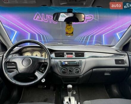 Сірий Міцубісі Lancer, об'ємом двигуна 1.58 л та пробігом 188 тис. км за 3799 $, фото 9 на Automoto.ua
