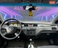 Сірий Міцубісі Lancer, об'ємом двигуна 1.58 л та пробігом 188 тис. км за 3799 $, фото 9 на Automoto.ua