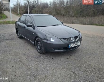 Серый Мицубиси Лансер, объемом двигателя 1.6 л и пробегом 305 тыс. км за 4000 $, фото 1 на Automoto.ua