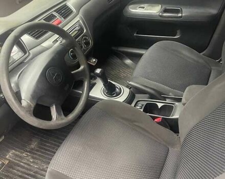 Сірий Міцубісі Lancer, об'ємом двигуна 1.58 л та пробігом 315 тис. км за 2350 $, фото 3 на Automoto.ua