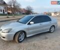 Серый Мицубиси Лансер, объемом двигателя 2 л и пробегом 249 тыс. км за 3800 $, фото 1 на Automoto.ua