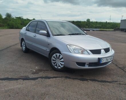 Серый Мицубиси Лансер, объемом двигателя 1.6 л и пробегом 250 тыс. км за 3600 $, фото 1 на Automoto.ua