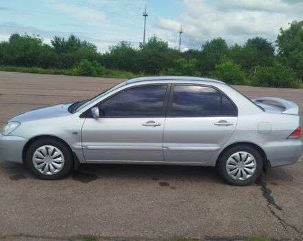 Серый Мицубиси Лансер, объемом двигателя 1.6 л и пробегом 250 тыс. км за 3600 $, фото 11 на Automoto.ua