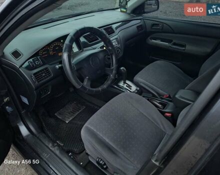 Серый Мицубиси Лансер, объемом двигателя 1.6 л и пробегом 305 тыс. км за 4000 $, фото 5 на Automoto.ua