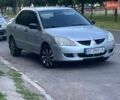 Серый Мицубиси Лансер, объемом двигателя 1.58 л и пробегом 190 тыс. км за 2600 $, фото 1 на Automoto.ua