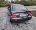 Серый Мицубиси Лансер, объемом двигателя 1.6 л и пробегом 281 тыс. км за 3641 $, фото 3 на Automoto.ua